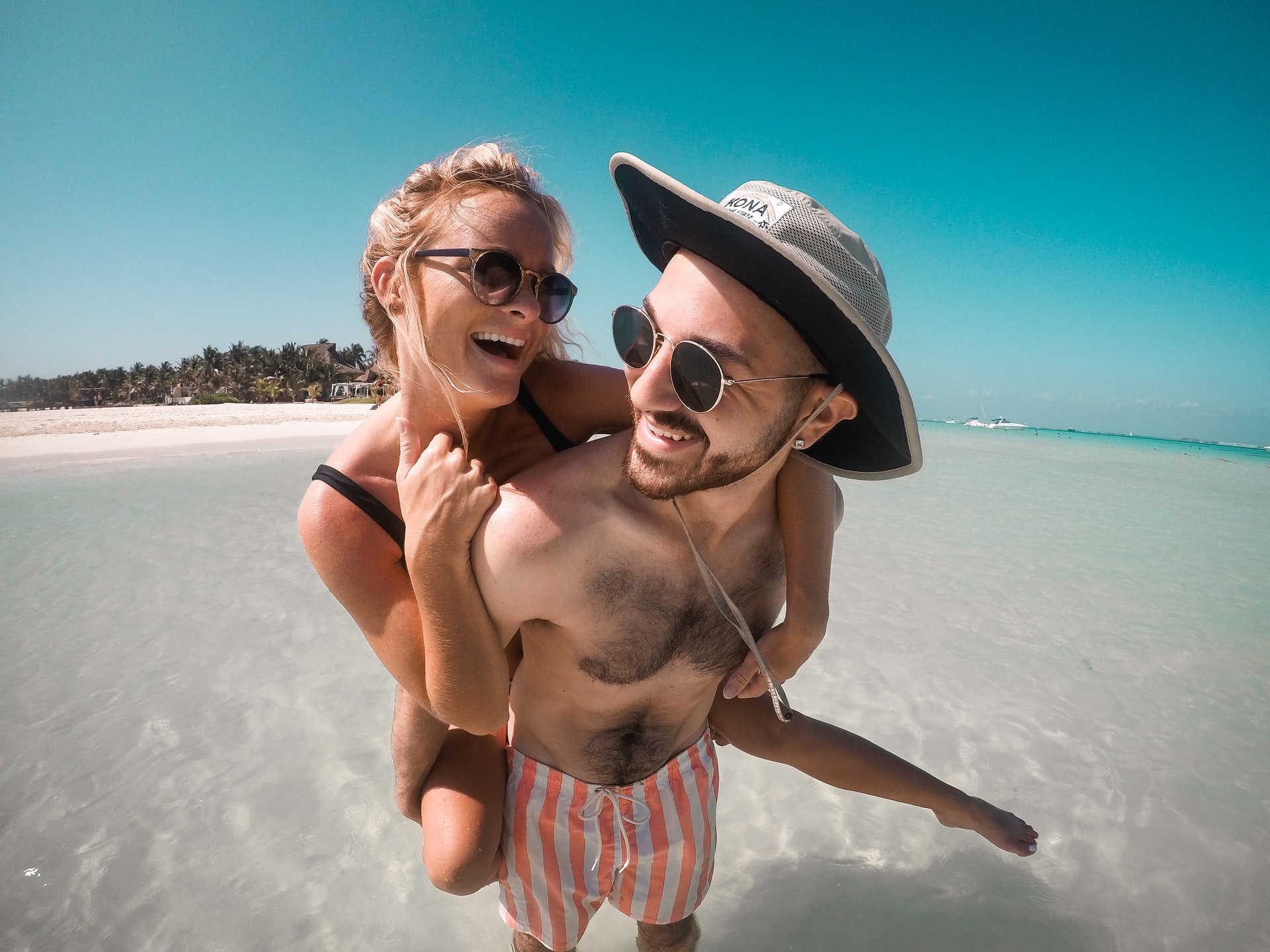 An image of a couple on a beach's background removed using no-bg